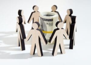 Close up of investors around savings deciding where to invest